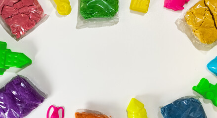 The layout of childrens kinetic sand and molds for sculpting in the form of a frame. Kids...