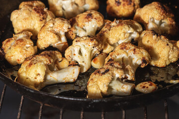 Roasted cauliflower with herbs and spices. Vegetarian food, healthy food baked in the oven. Selective focus