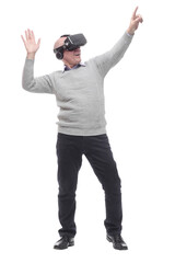in full growth. smiling man in virtual reality glasses.