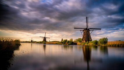 Europe, The Netherlands. Kinderdijk windmills at sunset.