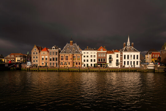 Europe, The Netherlands, Maassluis. Row of buildings on ocean pier.