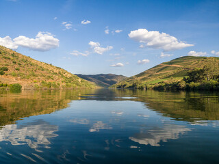 Portugal, Douro Valley. The Douro River with hillsides of terraced vineyards.