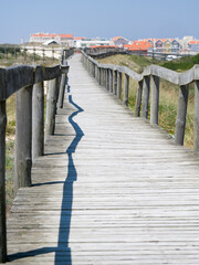 Portugal, Costa Nova. Beach and board walk at Costa Nova beach resort near Aveiro.