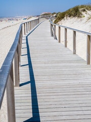 Portugal, Costa Nova. Beach and board walk at Costa Nova beach resort near Aveiro.