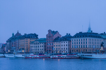 Obraz premium Sweden, Stockholm, Gamla Stan, Old Town, old town skyline, morning fog