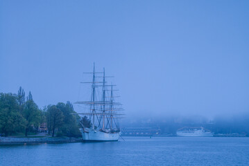 Fototapeta na wymiar Sweden, Stockholm, Gamla Stan, Old Town, sailing ship Chapman, fog