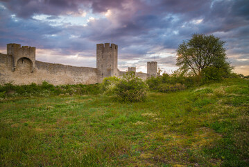 Fototapeta na wymiar Sweden, Gotland Island, Visby, 12th century city wall, most complete medieval city wall in Europe, dusk