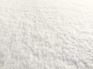 snow in sunny weather fresh background. high angle view of snow texture Natural winter background with snow drifts and falling snow