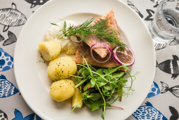 Sweden, Gotland Island, Katthammarsvik, traditional meal of salmon, greens and boiled potatoes