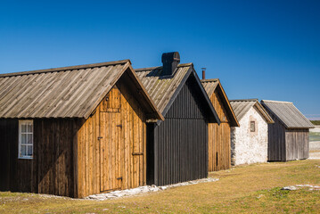Fototapeta na wymiar Sweden, Faro Island, Kursviken, coastal farmers fishing shacks