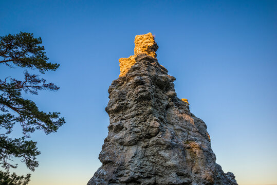 Sweden, Gotland Island, Lickershamn, limestone rauk rocks, Jungfrun, Maiden Rock, sunset