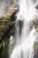 The cascading rocks and flowing water of Khlong Lan Waterfall beautiful and famous waterfall in national parks and in the rainforests of Thailand.