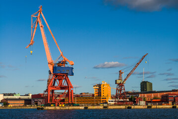 Fototapeta na wymiar Sweden, Vastragotland and Bohuslan, Gothenburg, shipyard crane, city skyline