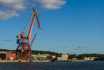 Sweden, Vastragotland and Bohuslan, Gothenburg, shipyard crane, city skyline