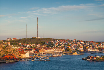 Sweden, Bohuslan, Kungshamn, high angle view of town and harbor, sunset