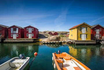 Fototapeta na wymiar Sweden, Bohuslan, Smogen, Smogenbryggan, antique boat houses and fishing shacks
