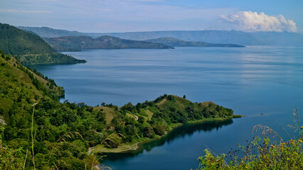 Naklejka na ściany i meble The beauty of Lake Toba which is a caldera lake comes from an ancient volcanic eruption and is the largest volcanic lake in the world. North Sumatra, Indonesia