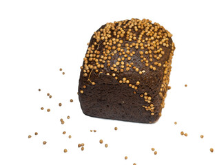 Black bread sprinkled with coriander.  Flour product. Bread with spices on white background