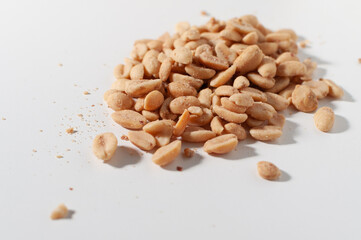 Salted peanuts on a white table