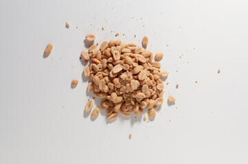 Salted peanuts on a white table