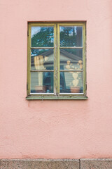 Sweden, Vastmanland, Nora, pink wall and window
