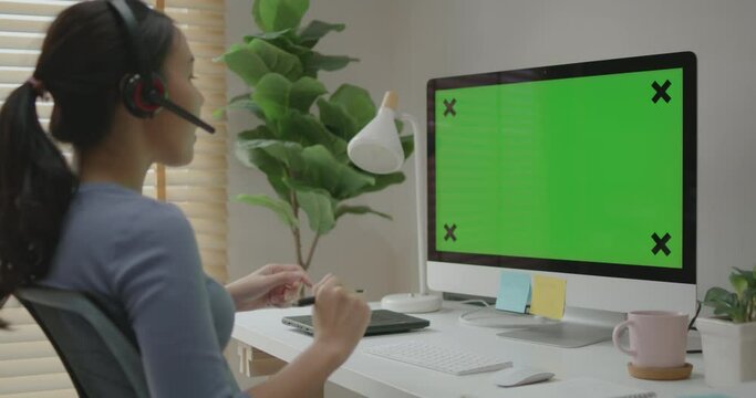 Happy smile asia young woman beautiful people learn or teach mba college on webcam video call platform in desktop pc laptop monitor empty screen on desk table work at home. Smart job staff workspace.