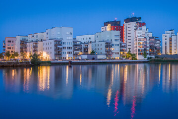 Sweden, Vastmanland, Vasteras, new residential buildings of the Munkangen harbor, dusk (Editorial...