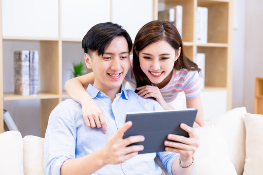 couple use tablet at home