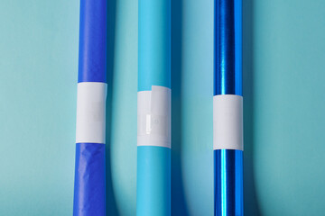Sky blue, turquoise blue, royal blue and sky blue paper tubes.