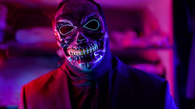 guardian of hell, mysterious man with mask of skull and black jacket, gloomy image for Halloween