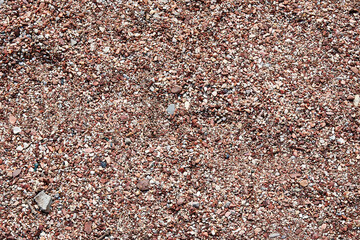 Coastal pebble texture with many small stones. Abstract natural backgrounds