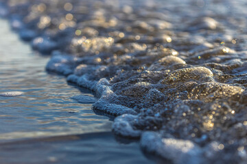 Detail of small wave on the beach