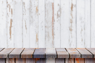 Empty wooden table in front perspective. white wooden wall background