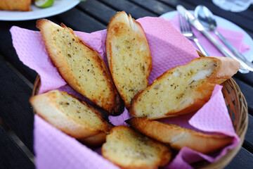 Closeup shot of baguette slices in a basket