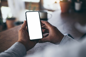 cell phone blank white screen mockup.hand holding texting using mobile on desk at office.background empty space for advertise.work people contact marketing business,technology