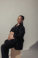 Black Pregnant Model with Cornrows