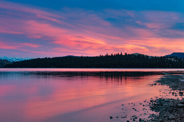 Fiery sunset clouds over Flathead Lake in Dayton, Montana, USA