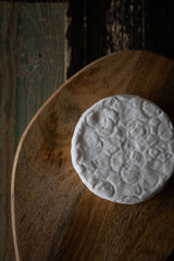 Homemade cheese with white mold. Top view.