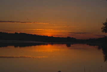 Obraz premium sunset over the river