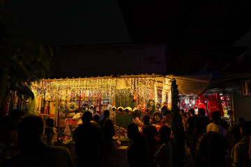 Ornamental Christmas lights Christmas market lightning paper lantern star hanging Kerala India lots...
