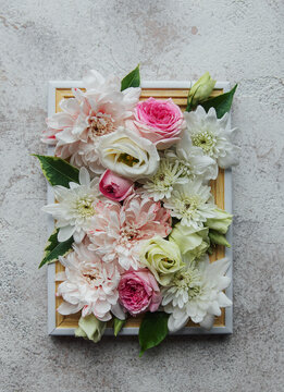 Wooden frame decorated with pink and white flowers