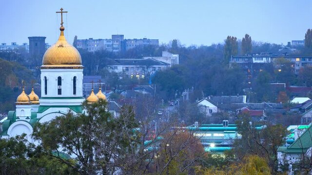 TIRASPOL, MOLDOVA - Nov 10, 2020: Day to Night timelapse transition of the Orthodox Church called "The Christmas Nativity Cathedral" in the center of downtown Tiraspol