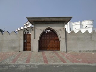 Korean style entrance gate design with boundary wall. 