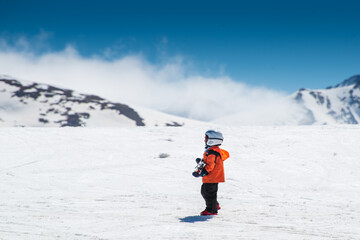 Little boy wainting her mother in a ski resort