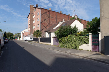 Fototapeta premium Old street in the industrial suburb of Paris. Ivry-sur-Seine city 