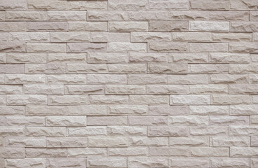 Cream and beige brick wall texture background. Brickwork and stonework flooring interior rock old pattern vintage brick wall backdrop