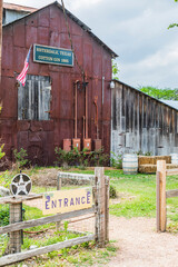 Fototapeta premium Sisterdale, Texas, USA. Historic cotton gin in the Texas Hill Country. (Editorial Use Only)