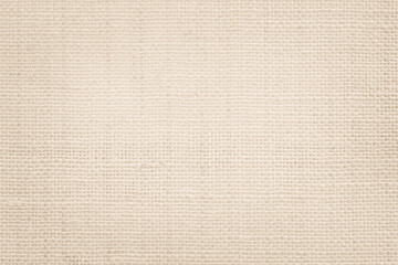 Jute hessian sackcloth canvas woven texture pattern background in light beige cream brown color blank empty