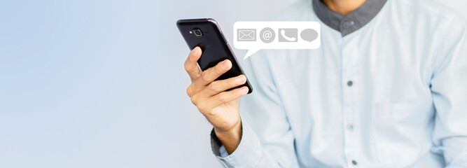 Close-up hand of businessman using smartphone with email, line, call and message icon and copy space background, Contact us and communication concept