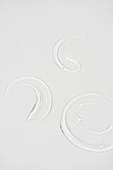 Close up of make up cosmetic gel smudge on white background. Minimalist beauty branding, merchandise concept